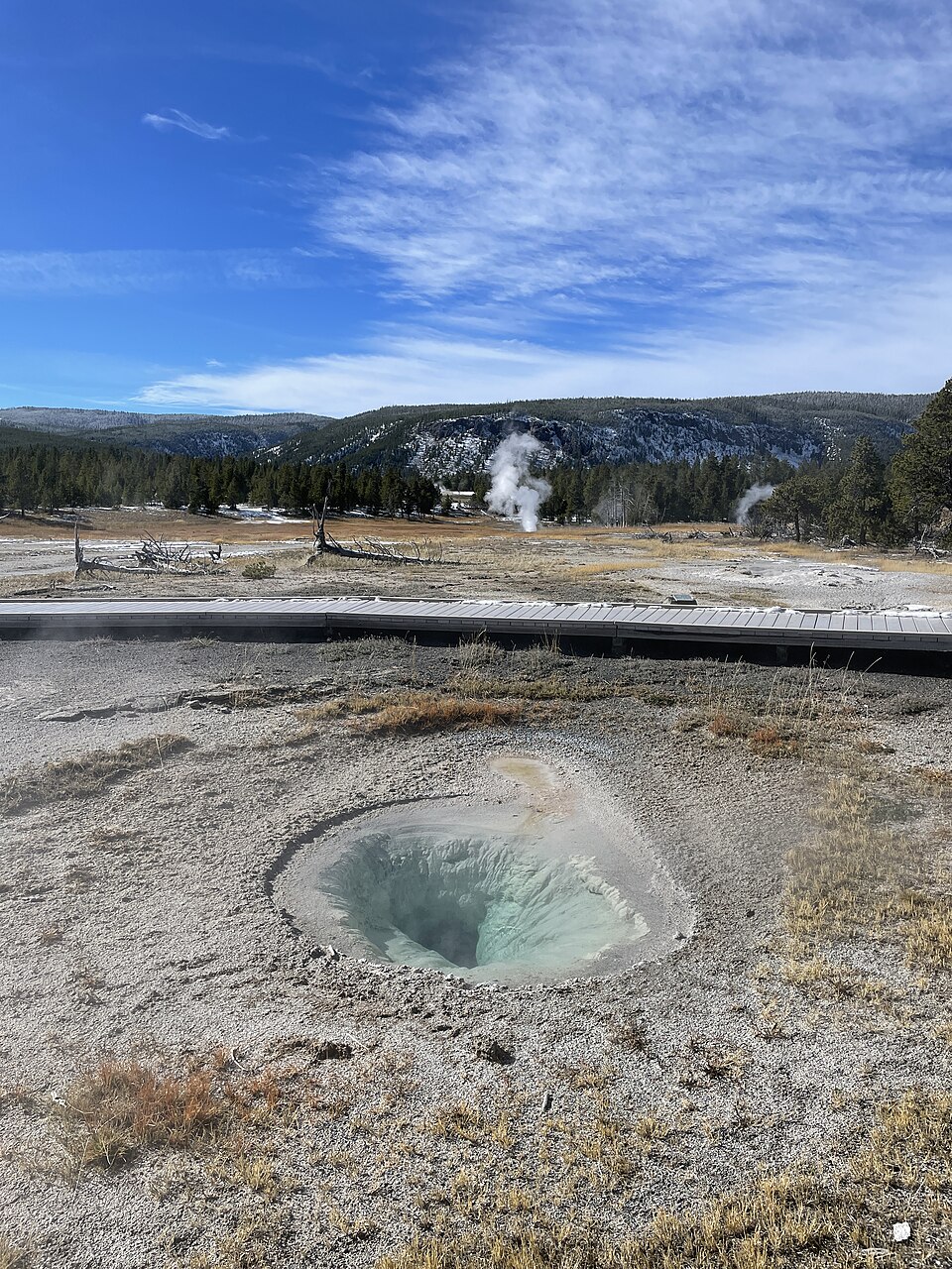 An upclose look at the entrance to a geyser, blue can be seen around the entrance.
