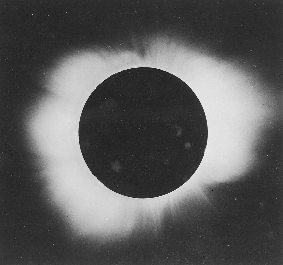 A black and white photograph of the Hyperian sun, eclipsed by the moon.